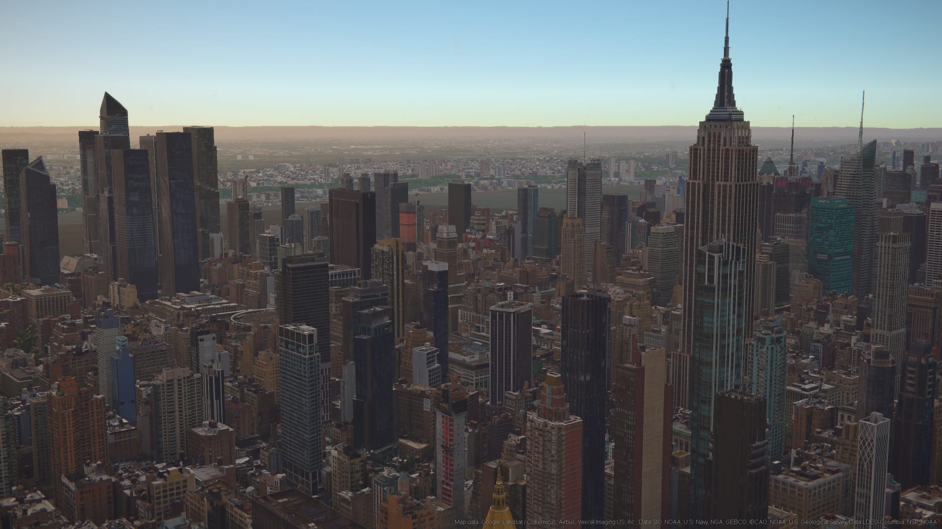 Midtown Manhattan at golden hour on the Photo Studio globe, low sun raking across the towers.